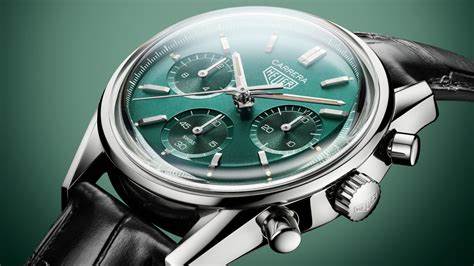 CBS2211.FC6545
 TAG Heuer Carrera Chronograph Automatic Watch. The 39mm case is stainless steel with a black alligator strap and deployment clasp. The watch features a chronograph function. The dial is circular brushed teal green with one minute counter sub-dial at 3 o'clock and date function at 9 o'clock.