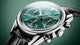 CBS2211.FC6545
 TAG Heuer Carrera Chronograph Automatic Watch. The 39mm case is stainless steel with a black alligator strap and deployment clasp. The watch features a chronograph function. The dial is circular brushed teal green with one minute counter sub-dial at 3 o'clock and date function at 9 o'clock.