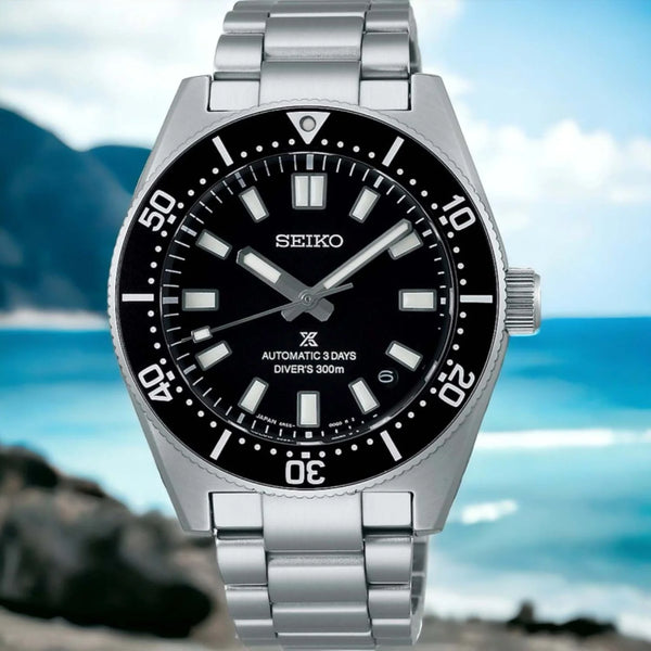 Gent's Seiko Prospex 1965 Heritage Divers 300m Automatic Watch. The 40mm case and bracelet are stainless steel. The bezel and dial are black. The glass is sapphire crystal. The watch has a date function and is 300m water resistant. The movement is automatic