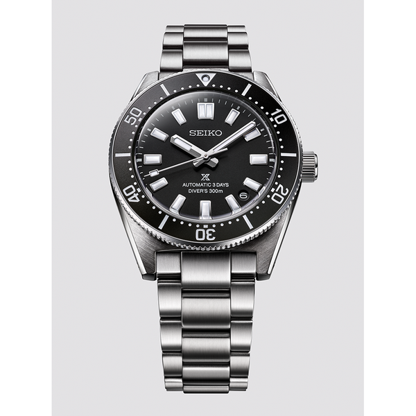 Gent's Seiko Prospex 1965 Heritage Divers 300m Automatic Watch. The 40mm case and bracelet are stainless steel. The bezel and dial are black. The glass is sapphire crystal. The watch has a date function and is 300m water resistant. The movement is automatic