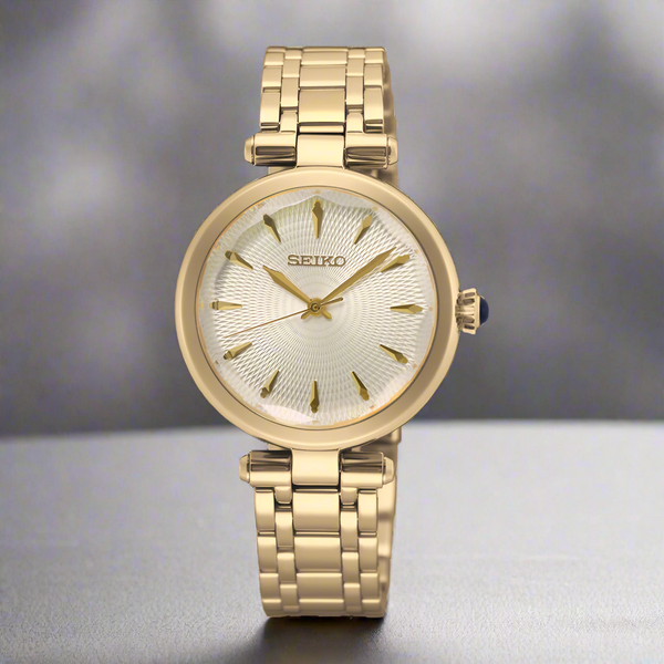 Gold Seiko watch on a white background