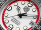 Close-up of a Tag Heuer watch face with red and black accents.