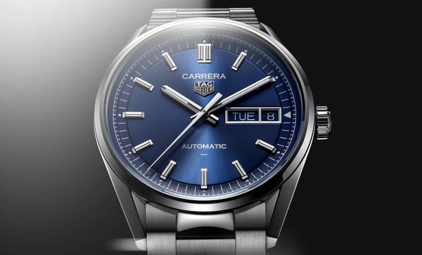 A stainless steel TAG Heuer Carrera automatic watch with a blue sunray-brushed dial, sapphire crystal glass, and a day/date function.Gent's TAG Heuer Carrera Automatic Watch. The 41mm case and bracelet are stainless steel.TAG Heuer Model Number: WDA2112.BA0043