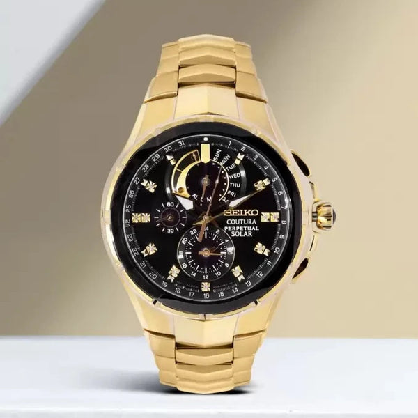 Seiko Coutura Solar Perpetual Calendar Chronograph Watch.  The case and bracelet are yellow gold plated stainless steel, the dial is black and the glass is sapphire crystal. The hour markers are diamond set.