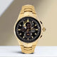 Seiko Coutura Solar Perpetual Calendar Chronograph Watch.  The case and bracelet are yellow gold plated stainless steel, the dial is black and the glass is sapphire crystal. The hour markers are diamond set.