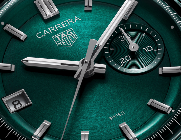 CBS2211.FC6545
 TAG Heuer Carrera Chronograph Automatic Watch. The 39mm case is stainless steel with a black alligator strap and deployment clasp. The watch features a chronograph function. The dial is circular brushed teal green with one minute counter sub-dial at 3 o'clock and date function at 9 o'clock.