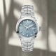 A stainless steel TAG Heuer Link watch with a blue mother-of-pearl dial and a sapphire crystal glass cover, featuring a date function and a silver bracelet.
