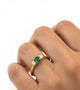 Handfinished 18k Yellow Gold Emerald and Diamond Three Stone Ring The ring is set with a0.32ct Round Natural Emerald Bright Green in Colour, measuring 4.4mm and 0.60ct Round Brilliant Cut diamonds The emerald and diamonds are set inline into U shaped four claw settings. &nbsp;The shank is slightly raised at the shoulder and has a rounded profile. &nbsp;Based on the stock finger size N, the ring weighs 3.2 grams. FG Colour, VS2-Sl1 Clarity.