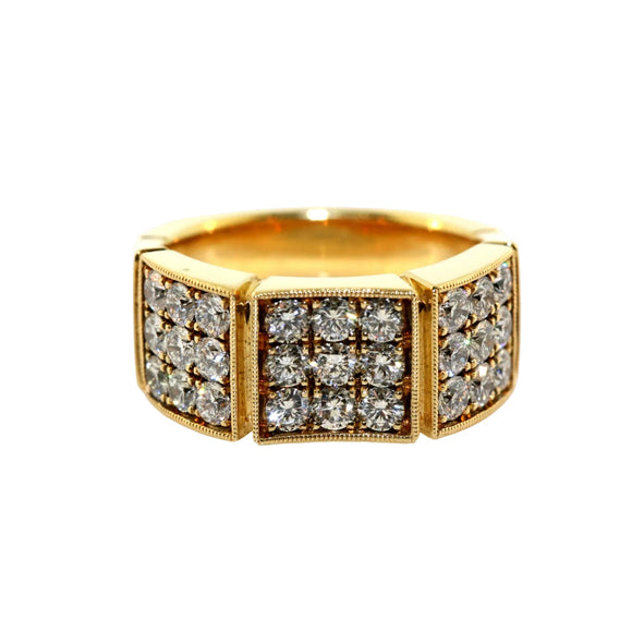 A yellow gold ring featuring three square pavé sections set with clear gemstones, photographed on a clean white background with a soft reflection.