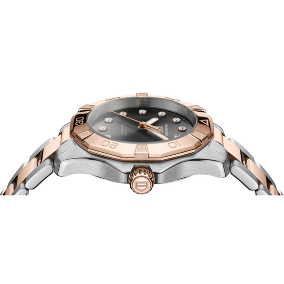 Watch with rose gold and silver band on a white background