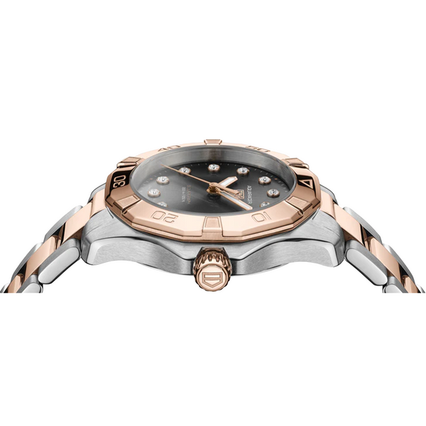 Watch with rose gold and silver band on a white background
