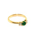 Handfinished 18k Yellow Gold Emerald and Diamond Three Stone Ring.&nbsp;The ring is set with a0.32ct Round Natural Emerald Bright Green in Colour, measuring 4.4mm and 0.60ct Round Brilliant Cut diamonds.The emerald and diamonds are set inline into U shaped four claw settings.The shank is slightly raised at the shoulder and has a rounded profile;Based on the stock finger size N, the ring weighs 3.2 grams. FG Colour, VS2-Sl1 Clarity.