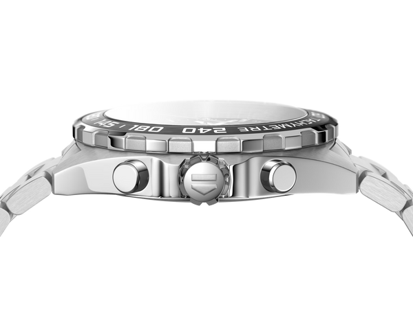 Close-up of a silver watch with detailed design on a white background