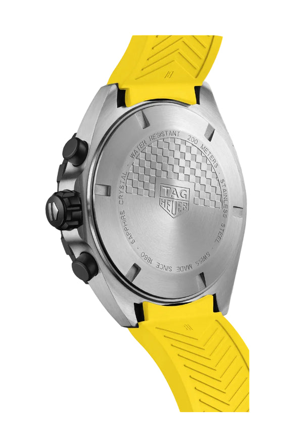 A TAG Heuer Formula 1 chronograph watch with a yellow dial, black bezel, stainless steel case, and a yellow rubber strap.