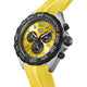 TAG Heuer watch with a bright yellow dial and matching yellow textured strap, featuring a black tachymeter bezel and silver-tone case on a black background.