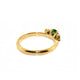 Handfinished 18k Yellow Gold Emerald and Diamond Three Stone Ring.&nbsp;The ring is set with a0.32ct Round Natural Emerald Bright Green in Colour, measuring 4.4mm and 0.60ct Round Brilliant Cut diamonds;The emerald and diamonds are set inline into U shaped four claw settings. &nbsp;The shank is slightly raised at the shoulder and has a rounded profile. &nbsp;Based on the stock finger size N, the ring weighs 3.2 grams. FG Colour, VS2-Sl1 Clarity.