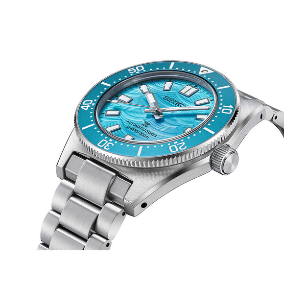Brand: Seiko

Model Number: HBC011J

Description:
Gent's Seiko Prospex 1965 Heritage Diver’s Fan-Selected Limited Edition Automatic Watch, celebrating the 60th anniversary of the Seiko Diver’s Watch. The 40mm case and bracelet are stainless steel. The bezel and dial are aqua coloured with the dial featuring a special wave-mark pattern. The glass is sapphire crystal. The watch has a date function and is 300 metres water resistant. The clasp has a special bracelet size adjustment. The movement is automatic wi