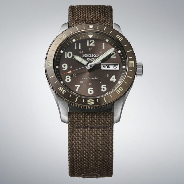 Gent's Seiko 5 Sports Field Series Automatic Watch.

Model Number: HDB009K

Availability: in stock

The 41mm case is stainless steel with a brown nylon strap. The bezel is brown with compass indicators. The dial is brown with a day / date function. The watch has a see-through case back and is 100m water resistant. The movement is automatic.