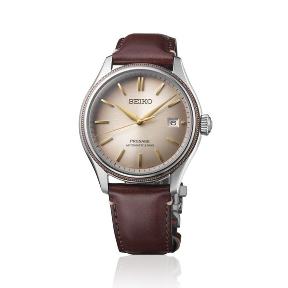 Gents Seiko Presage Classic Automatic Watch. The 40.2mm case and bracelet are stainless steel. The dial is blue with a textured pattern, 24-hour scale sub-dial and circlular shaped movement window. The watch has a curved sapphire crystal glass with a see-through case back and is 100m water resistant. The movement is automatic with a 3-day power reserve.&nbsp;