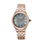 Rose gold Seiko watch with a dark face on a black background