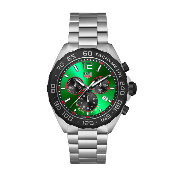 A TAG Heuer Formula 1 chronograph quartz watch with a green dial, black stainless steel case and bracelet, and red accents.