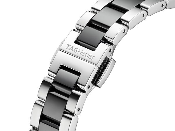 Ladies' TAG Heuer Aquaracer 35mm Watch. The case and bracelet are bicolour stainless steel and black ceramic links/bezel, the dial is black and the glass is sapphire crystal. The watch features a diamond set dial and date function. The watch is 300 metres water resistant and the movement is quartz. 