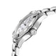 Silver watch with a white face on a white background