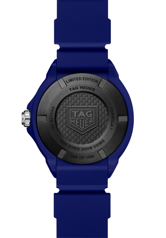Blue watch with black dial featuring TAG Heuer logo on a white background