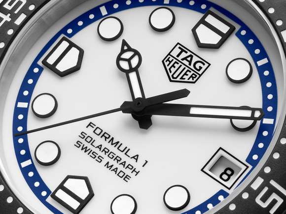 Close-up of a Tag Heuer watch face with blue and black accents.