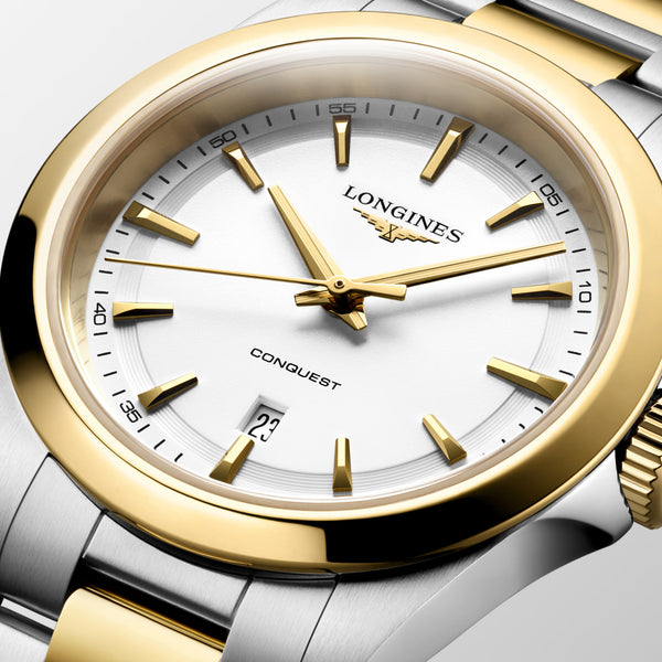 Ladies' Longines Conquest Quartz Watch.
Model Number: L33503127
The 30mm case and bracelet are bicolour: stainless steel with a yellow gold PVD bezel and middle bracelet links. The dial is white with gold coloured hands and indexes. The glass is sapphire crystal. The watch has a date function and is 100m water resistant. The movement is quartz.