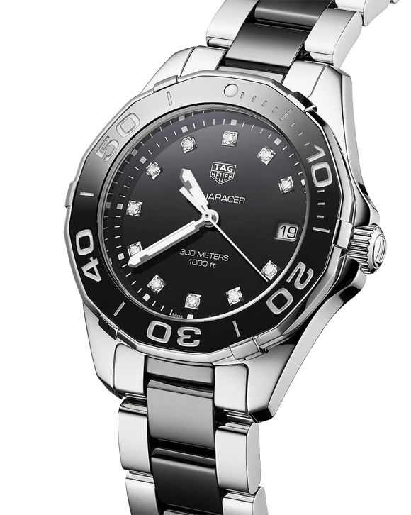 Ladies' TAG Heuer Aquaracer 35mm Watch. The case and bracelet are bicolour stainless steel and black ceramic links/bezel, the dial is black and the glass is sapphire crystal. The watch features a diamond set dial and date function. The watch is 300 metres water resistant and the movement is quartz. 