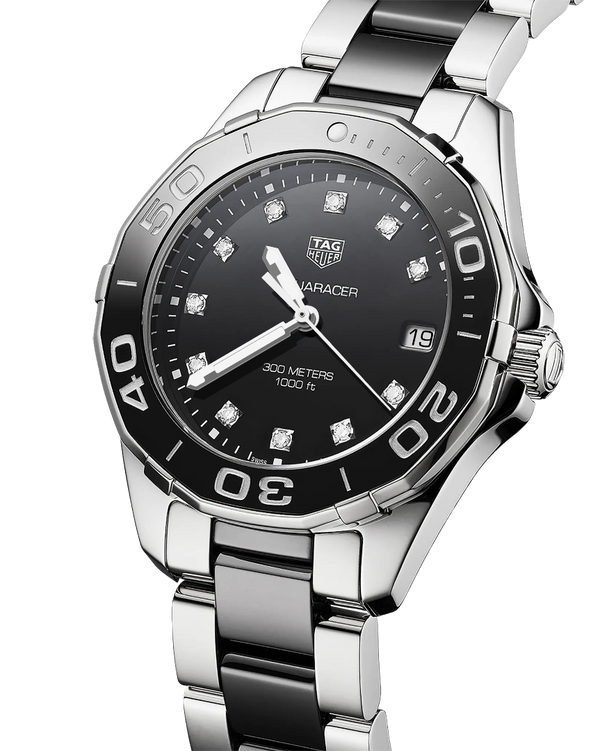 Ladies' TAG Heuer Aquaracer 35mm Watch. The case and bracelet are bicolour stainless steel and black ceramic links/bezel, the dial is black and the glass is sapphire crystal. The watch features a diamond set dial and date function. The watch is 300 metres water resistant and the movement is quartz. 