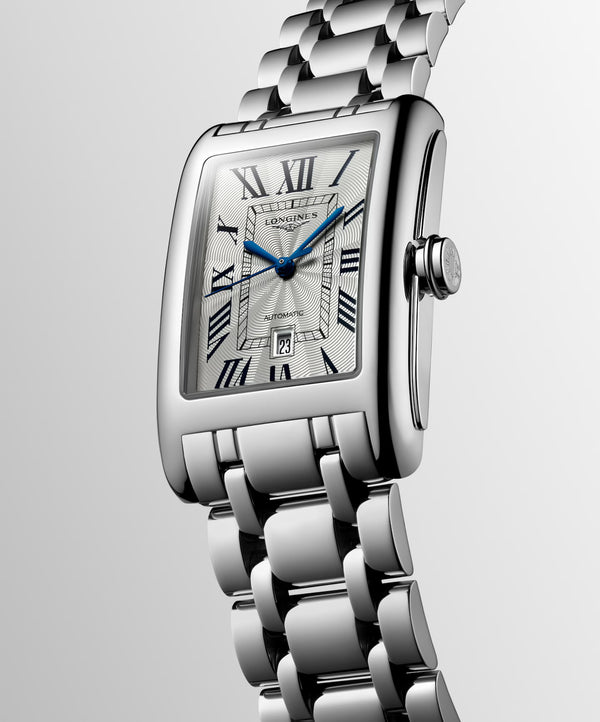 Gent's Longines Dolce Vita Automatic Watch.

Model Number: L57574716

Availability: in stock

The 27.7 x 43.8mm rectangular case and bracelet are stainless steel. The dial is silver with a flinque pattern, black roman numerals, blue hands and a date function. The glass is sapphire crystal. The movement is automatic.