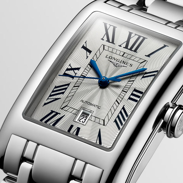 Gent's Longines Dolce Vita Automatic Watch.

Model Number: L57574716

Availability: in stock

The 27.7 x 43.8mm rectangular case and bracelet are stainless steel. The dial is silver with a flinque pattern, black roman numerals, blue hands and a date function. The glass is sapphire crystal. The movement is automatic.