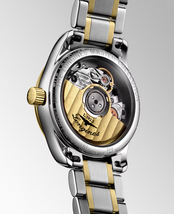 Ladies' Longines Master Collection Automatic Watch. The 25.5mm case and bracelet are bicolour: stainless steel with 18k yellow gold capped bezel and capped centre links. The dial is white mother-of-pearl with twelve diamond set hour markers and a date function. The glass is sapphire crystal and the case back is transparent sapphire crystal &nbsp;glass. The movement is automatic.