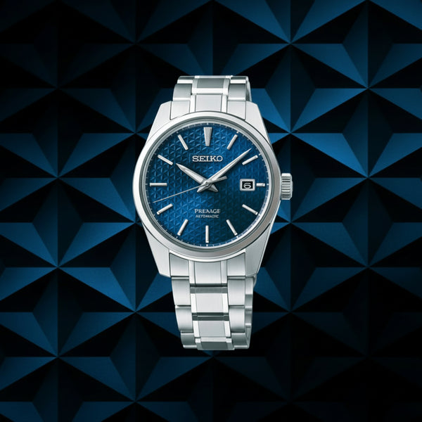 Seiko 5 Sports SNXS Series 37.4mm Stainless Steel Case and Bracelet Blue Dial Day/Date Function See-Through Case Back 100m Water Resistant Automatic Watch.  