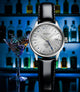 Seiko watch with black leather strap on a blurred background