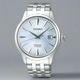 Silver Seiko watch with a white face on a white background