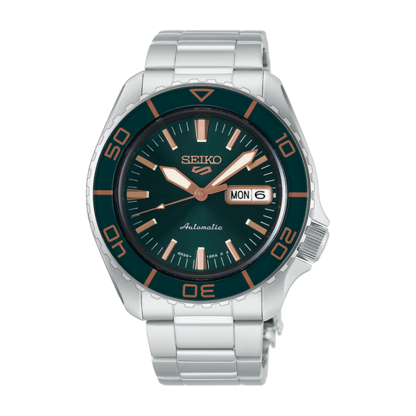 Gent's Seiko 5 Sports SKX Series Automatic Watch.

Model Number: HDB005K

Availability: in stock

The 42.5mm case and bracelet are stainless steel. The bezel is green. The dial is green with rose coloured hands and indexes and a day/date function. The watch has a see-through case back and is 100m water resistant. The movement is automatic.